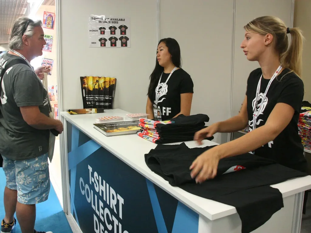 T-shirt collection desk at an event, printed by Garment Printing