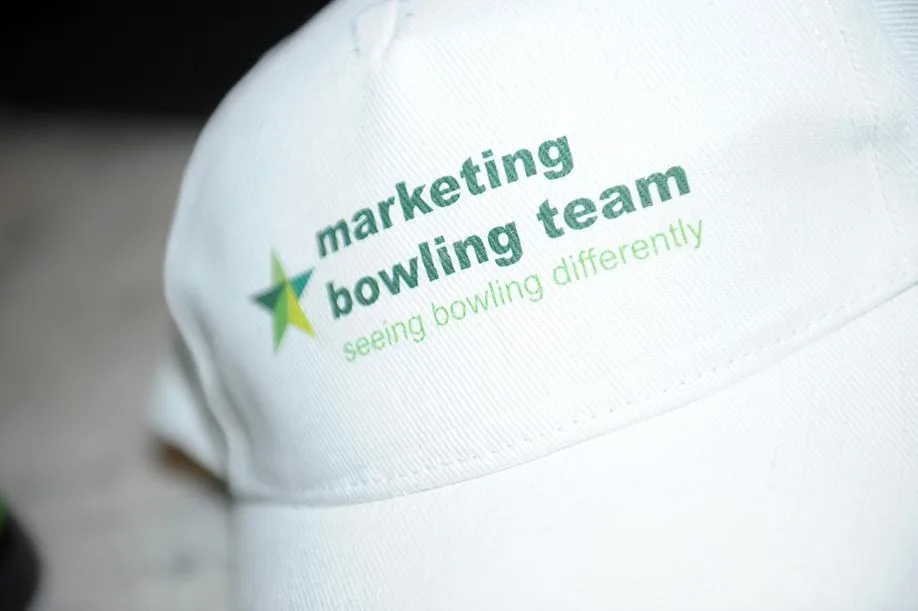 Personalised cap for a company bowling team