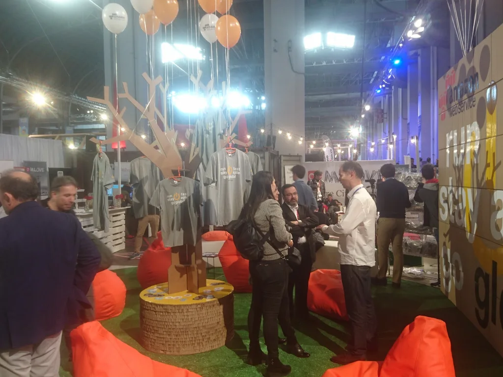 Amazon Web Services team in printed T-shirts at Mobile World Congress