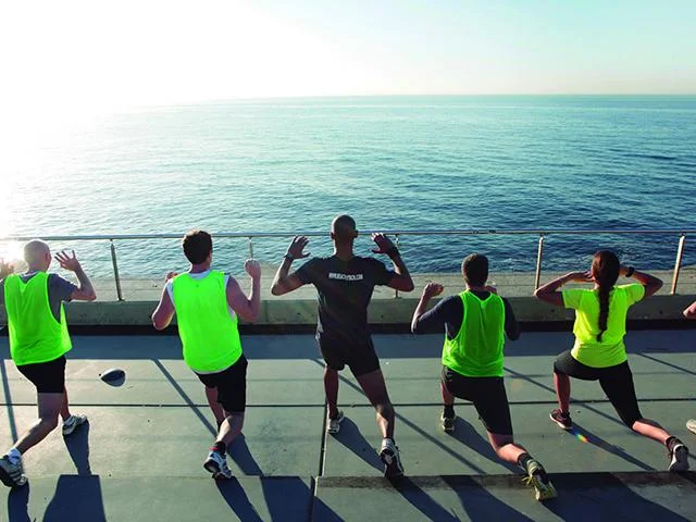 BeachFit Barcelona training in their printed vests