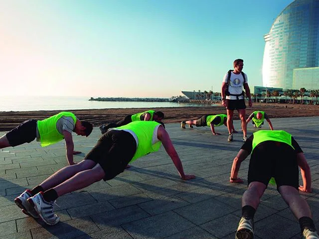 BeachFit Barcelona training in their printed vests