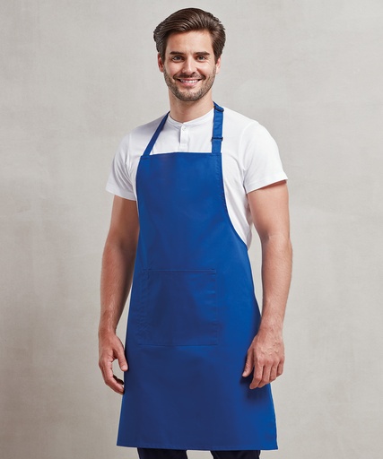 Man in a royal blue bib apron, before printing